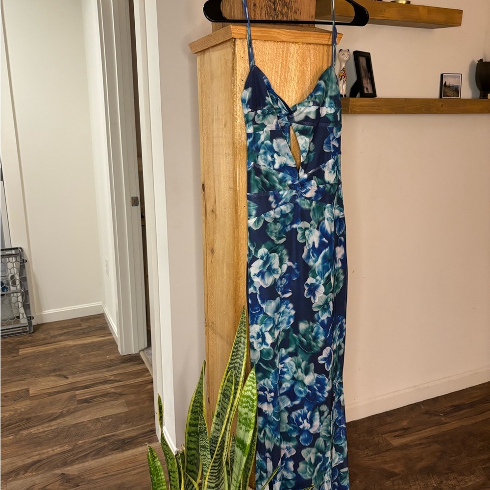Absolutely stunning wedding guest dress with blue and green floral pattern.